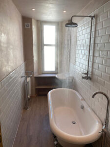 Freestanding Victorian bath with chrome feet, complete with a freestanding bath tap